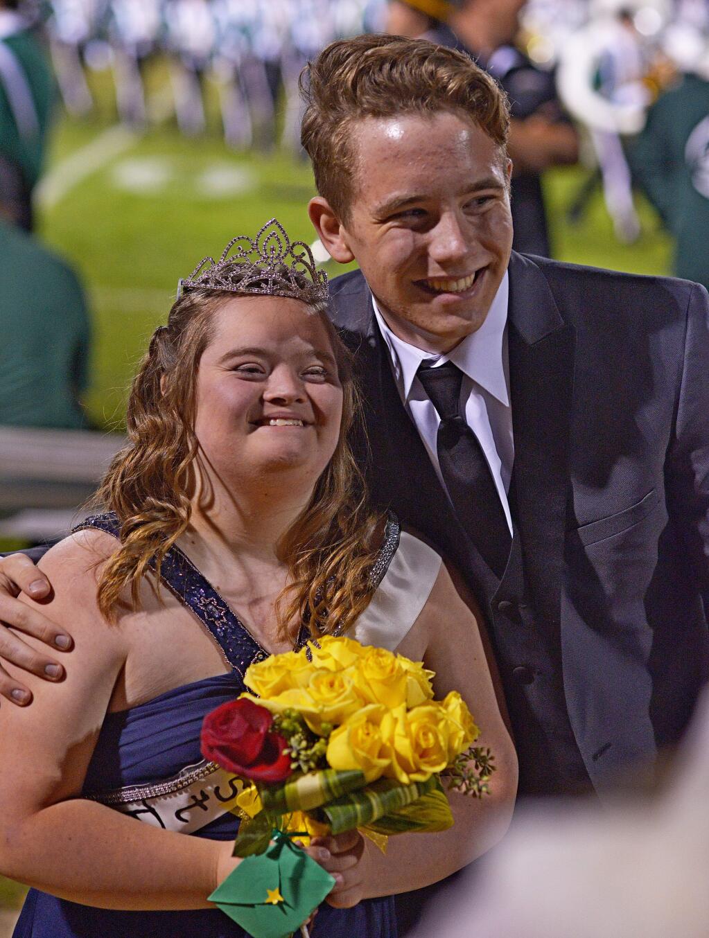 SUMNER FOWLER/FOR THE ARGUS-COURIERCasa Grande High School senior Danielle Kainz is all smiles after being crowned Homecoming Queen, as is her escort Caleb Dame.