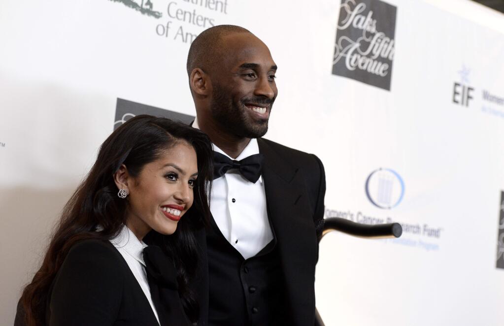 FILE - In this May 2, 2013, file photo, Lakers guard Kobe Bryant, right, and his wife Vanessa Bryant arrive at 'An Unforgettable Evening' benefiting EIF's Women's Cancer Research Fund at The Beverly Wilshire in Beverly Hills, Calif. Kobe Bryant revealed on Instagram July 12, 2016, that the couple is expecting another baby. (Photo by Dan Steinberg/Invision/AP, File)