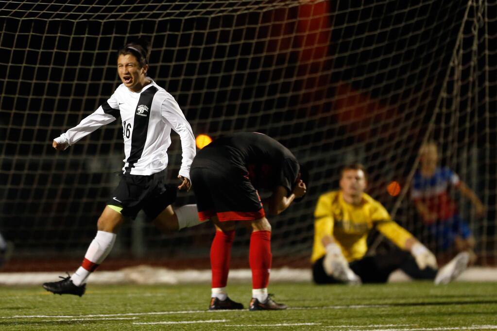 Santa Rosa's Anthony Lopez (16) celebrates his second-half goal while Monte Vista players react around him during the NCS Division 1 semifinal boys soccer match in Glen Ellen on Wednesday, Feb. 24, 2016. (Alvin Jornada / The Press Democrat)