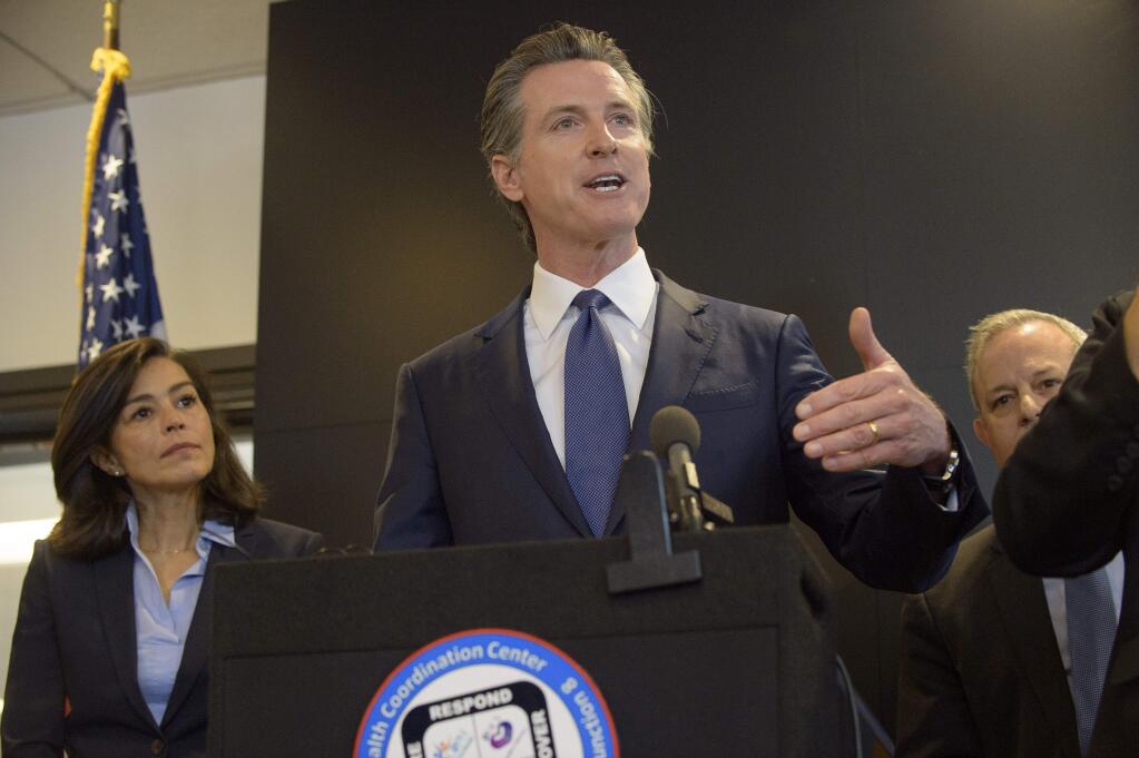 California Governor Gavin Newsom speaks to members of the press at a news conference in Sacramento, Calif., Thursday, Feb. 27, 2020. Newsom spoke about the state's response to novel coronavirus, also known as COVID-19. Yesterday, the Centers for Disease Control and Prevention confirmed a possible first case of person-to-person transmission of COVID-19 in California in the general public.(AP Photo/Randall Benton)