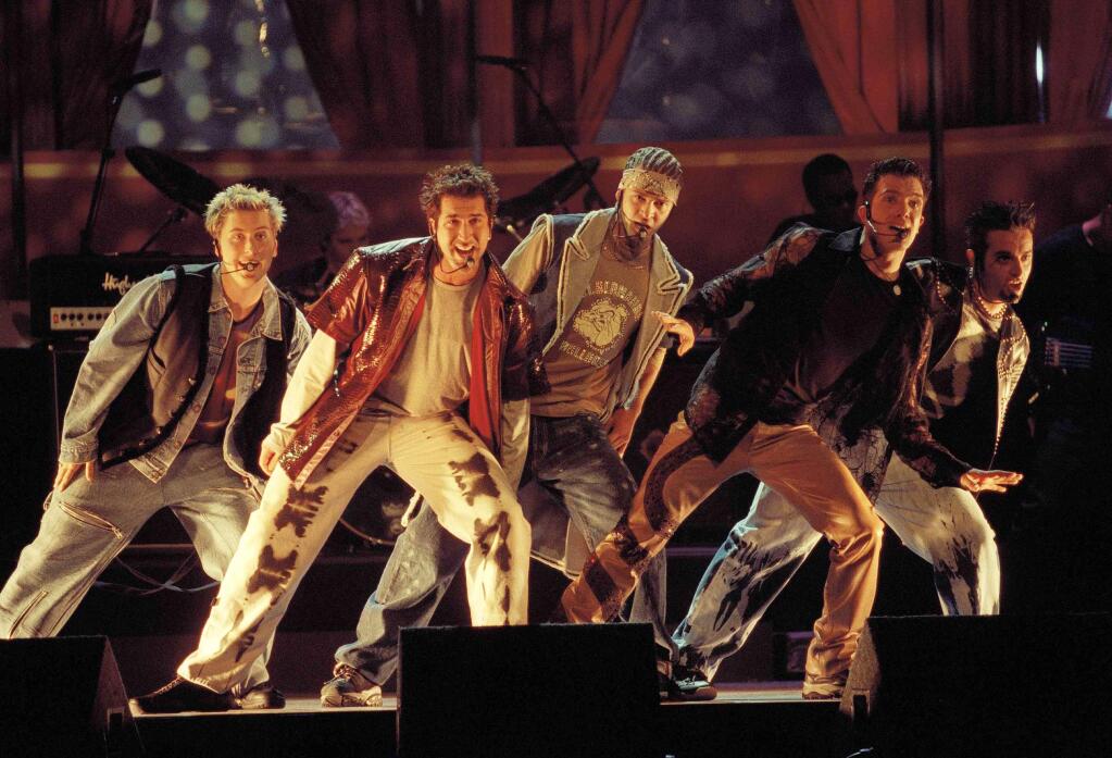 FILE - In this June 3, 2000 file photo, members of NSync, from left, Lance Bass, Joey Fatone, Justin Timberlake, JC Chasez and Chris Kirkpartrick perform at the 9th annual MTV Movie Awards in Culver City, Calif. The boy band will earn a star on the Hollywood Walk of Fame on April 30. (AP Photo/Chris Pizzello, File)