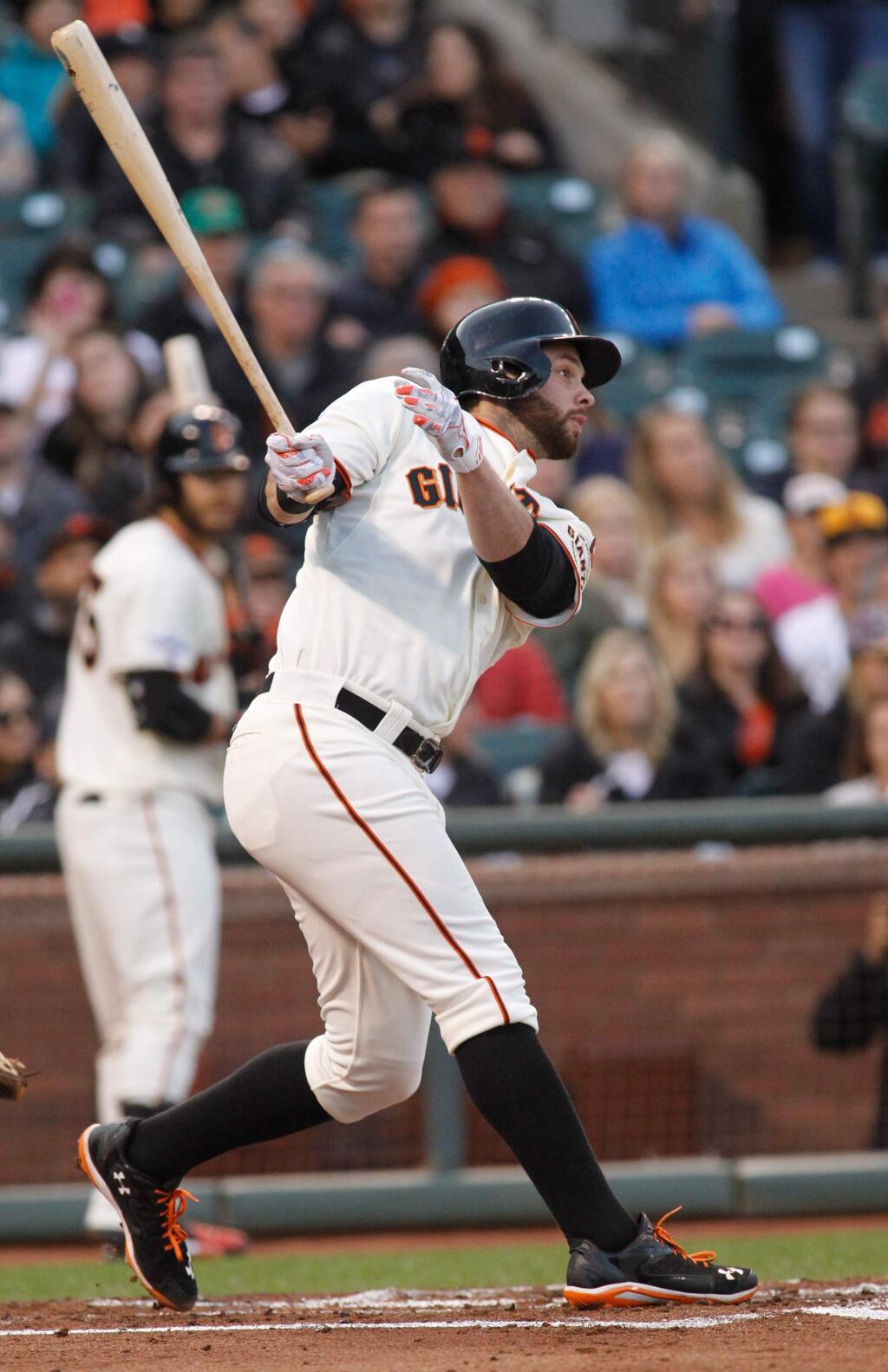 San Francisco Giants' Brandon Belt hits a double during the second inning of a baseball game against the San Diego Padres, Tuesday, May 5, 2015, in San Francisco. (AP Photo/Mathew Sumner)