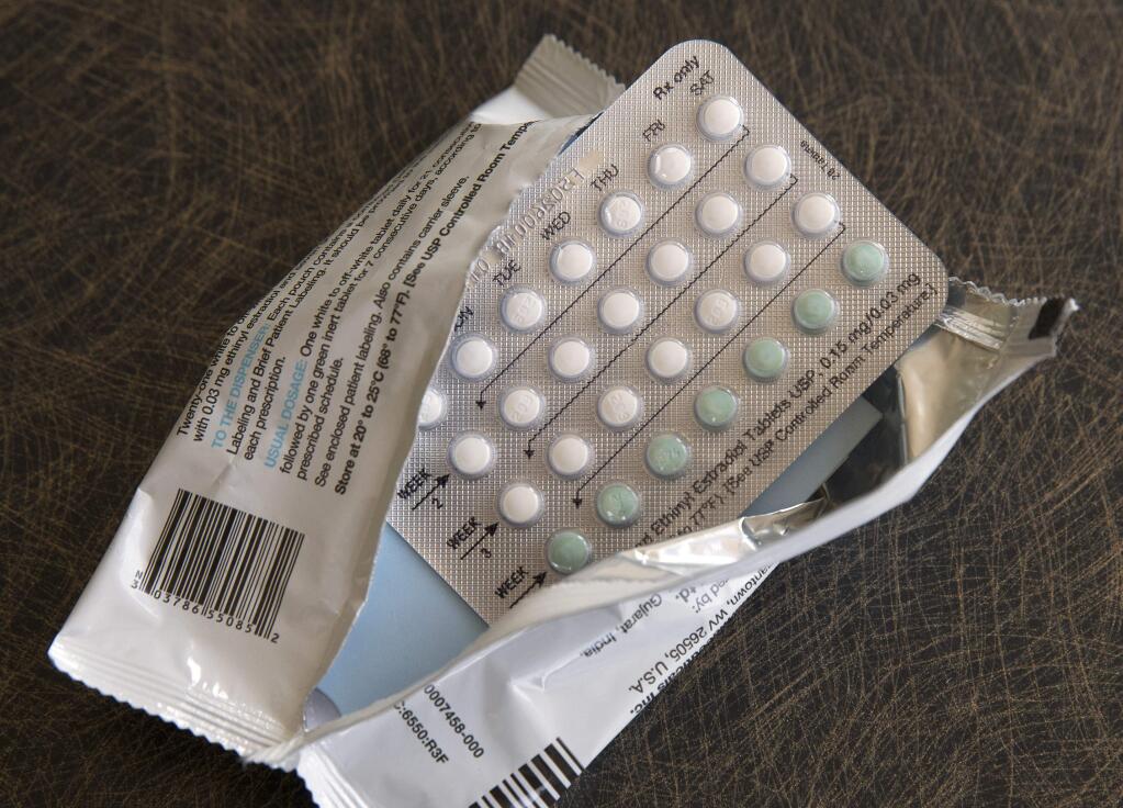 FILE - This Friday, Aug. 26, 2016 file photo shows a one-month dosage of hormonal birth control pills in Sacramento, Calif. Modern birth control pills that are lower in estrogen have fewer side effects than past oral contraceptives. But a large Danish study released on Wednesday, Dec. 6, 2017, suggests that, like older pills, they still modestly raise the risk of breast cancer, especially with long-term use. (AP Photo/Rich Pedroncelli)