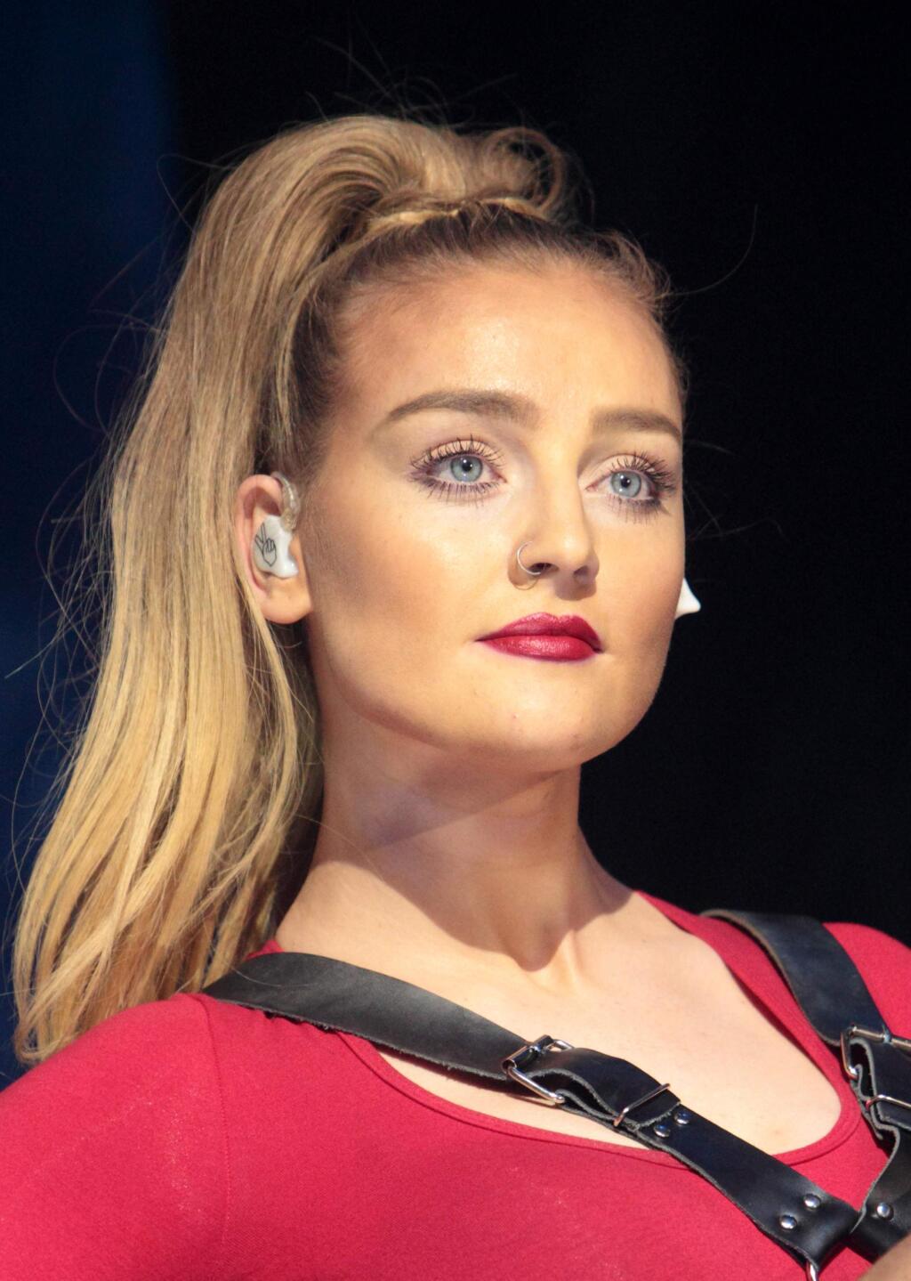 FILE - In this March 4, 2014 file photo, Perrie Edwards of the British pop music group Little Mix performs in concert in Bethlehem, Pa. Former One Direction member Zayn Malik and Edwards have called off their engagement.A representative for Malik on Tuesday, Aug. 4, 2015, confirmed that the couple ended their engagement. No more details were provided. (Photo by Owen Sweeney/Invision/AP, File)