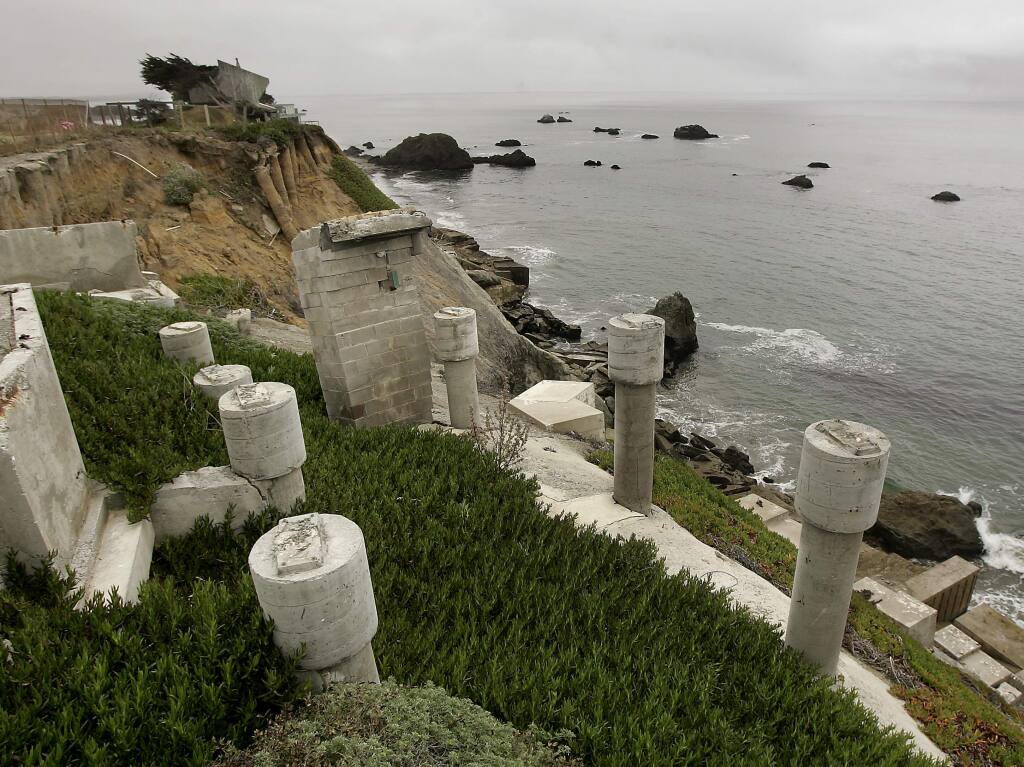 Calms seas belie the constant erosion that has eaten away at bluffside homes at Gleason Beach, Thursday August 20, 2009 north of Bodega Bay. (Kent Porter / Press Democrat) 2009