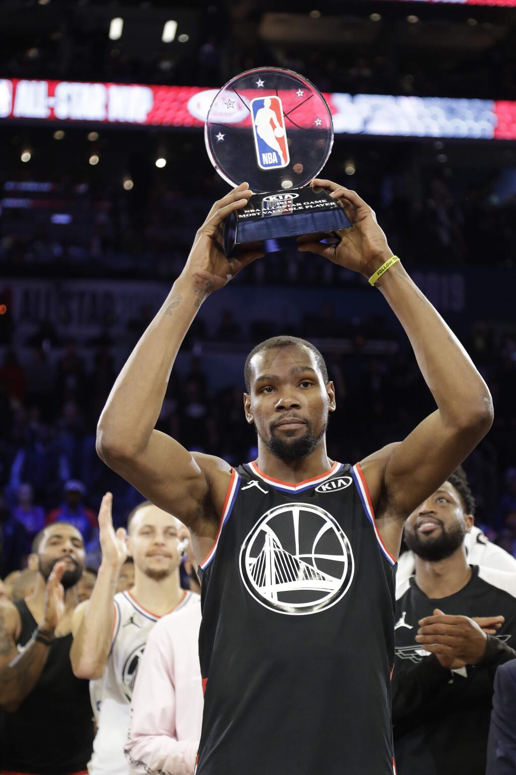 Team LeBron's Kevin Durant, of the Golden State Warriors holds his MVP trophy after the NBA All-Star basketball game, on Sunday, Feb. 17, 2019, in Charlotte, N.C. The Team LeBron won 178-164. (AP Photo/Chuck Burton)