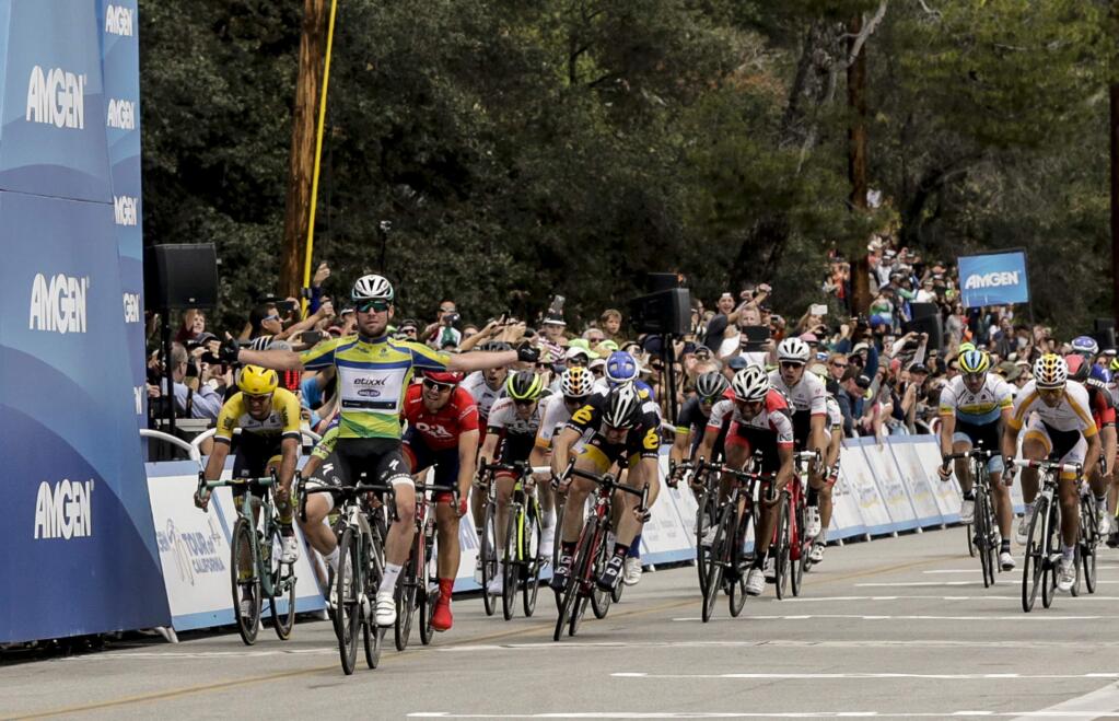 Mark Cavendish of Great Britain riding for Etixx-QuickStep, left, celebrates as he wins the final stage of the 2015 Amgen Tour of California cycling race 65.3 miles from Los Angeles to Pasadena on Sunday, May 17, 2015, in Pasadena, Calif. (AP Photo/Damian Dovarganes)