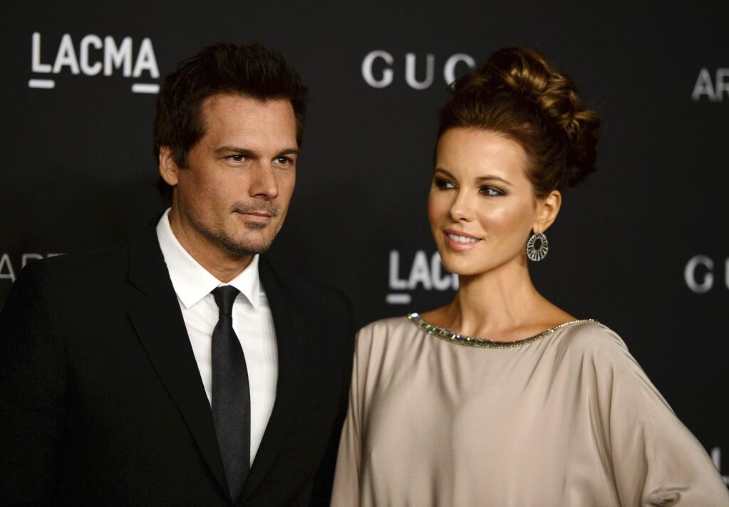 FILE - In this Nov. 1, 2014 file photo, director Len Wiseman, left, and actress Kate Beckinsale arrive at the LACMA Art + Film Gala in Los Angeles. Los Angeles court records show that Wiseman filed for divorce from Beckinsale on Friday, Oct. 21, 2016, citing irreconcilable differences. The couple have been married for 12 years. (Photo by Jordan Strauss/Invision/AP, File)