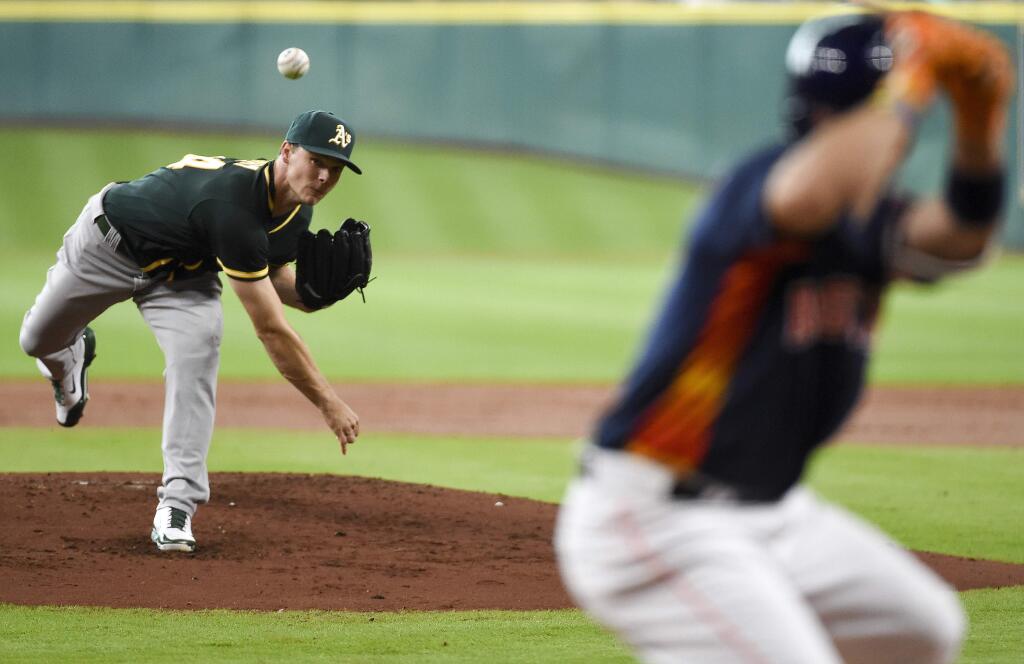 Oakland Athletics starting pitcher Sonny Gray, left, delivers to Houston Astros' Jose Altuve during the first inning of a baseball game, Sunday, June 5, 2016, in Houston. (AP Photo/Eric Christian Smith)