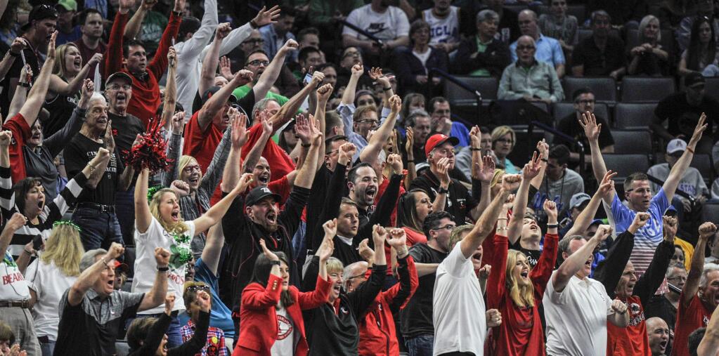 Cincinnati fans celebrate in the closing moments of the team's 65-61 win over Kansas State in a first-round game of the men's NCAA tournament in Sacramento, Friday, March 17, 2017. (AP Photo/Bryan Patrick)