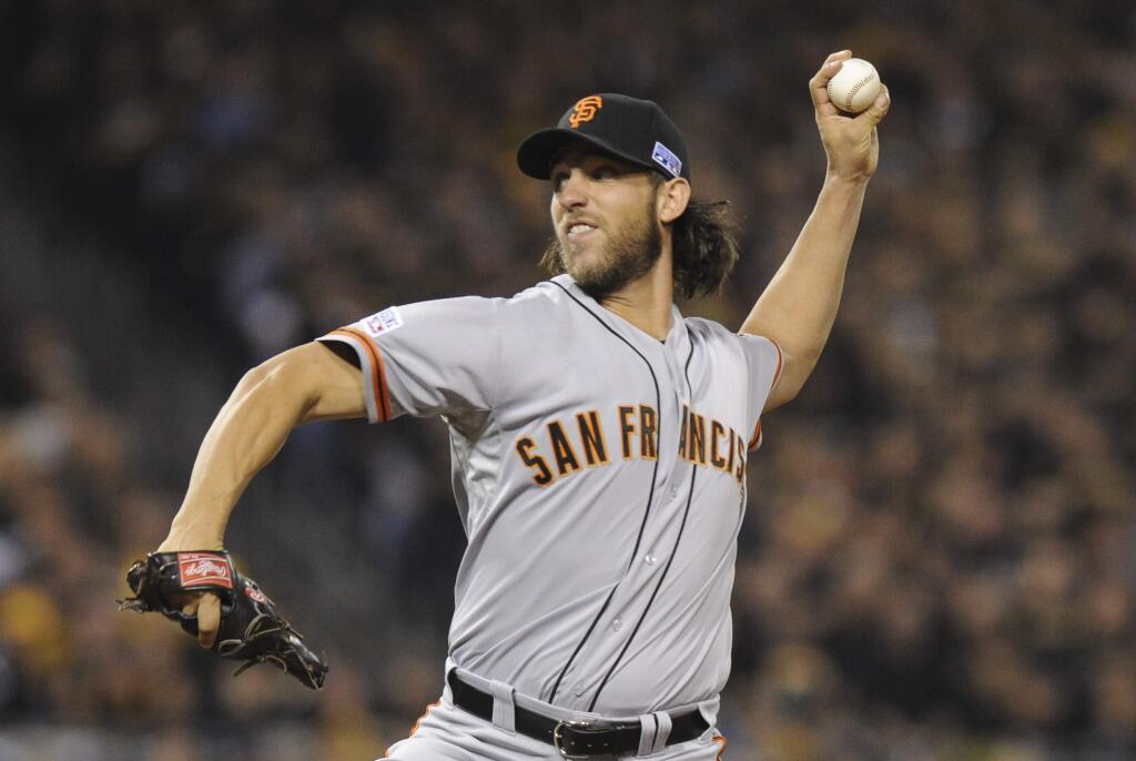 San Francisco Giants starting pitcher Madison Bumgarner throws against the Pittsburgh Pirates in the first inning of a wild-card playoff baseball game Wednesday, Oct. 1, 2014, in Pittsburgh. (AP Photo/Don Wright)