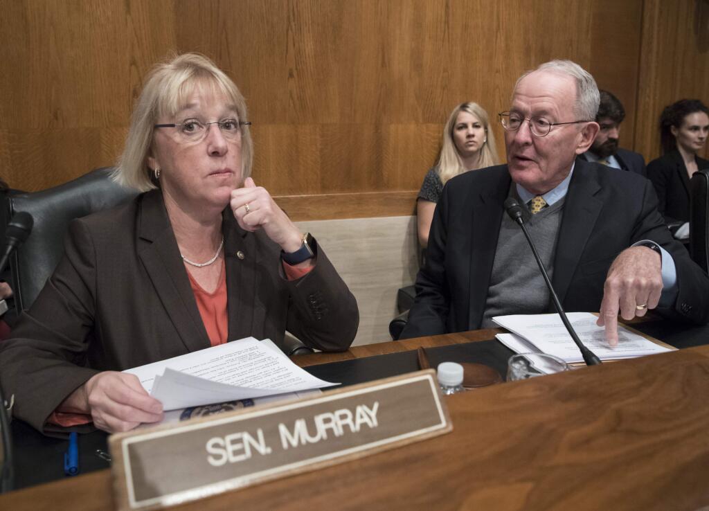 Sen. Patty Murray, D-Wash., the ranking member, and Sen. Lamar Alexander, R-Tenn., chairman of the Senate Health, Education, Labor, and Pensions Committee, meet before the start of a hearing on Capitol Hill in Washington, Wednesday, Oct. 18, 2017. (AP Photo/J. Scott Applewhite)