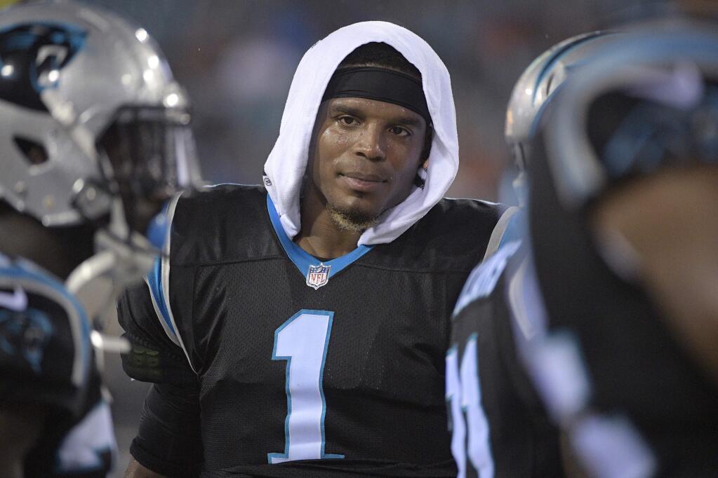 FILE - In this Aug. 24, 2017, file photo, Carolina Panthers quarterback Cam Newton (1) watches from the sideline during the first half of an NFL preseason football game against the Jacksonville Jaguars in Jacksonville, Fla. Newton played just one series in the preseason but the Panthers aren't worried about him heading into the season. (AP Photo/Phelan M. Ebenhack, File)