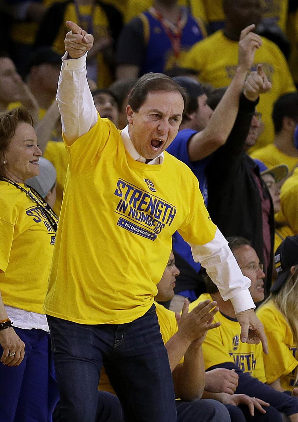 In this May 5, 2015, file photo, Golden State Warriors owner Joe Lacob reacts during the second half of Game 2 in a second-round playoff series between the Warriors and the Memphis Grizzlies in Oakland. Lacob can't help but feel a little vindicated now that the franchise is in the NBA Finals for the first time in 40 years. From getting booed by fans after trading Monta Ellis to the questionable decision to fire Mark Jackson as coach, Lacob's moves over the last five years have all led to this: a championship matchup with LeBron James and the Cleveland Cavaliers. (AP Photo/Ben Margot, File)
