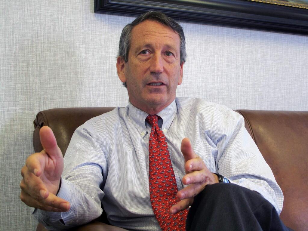 FILE - In this Dec. 18, 2013, file photo, U.S. Rep. Mark Sanford, R-S.C., discusses his first months back in Congress during an interview in Mount Pleasant, S.C. Sanford said Tuesday, July 16, 2019 he's pondering a 2020 primary challenge to President Donald Trump, but political observers - and those who know the former governor and congressman well - say it's nothing more than an attempt to keep himself relevant in the wake of his first-ever electoral loss last year. (AP Photo/Bruce Smith, File)