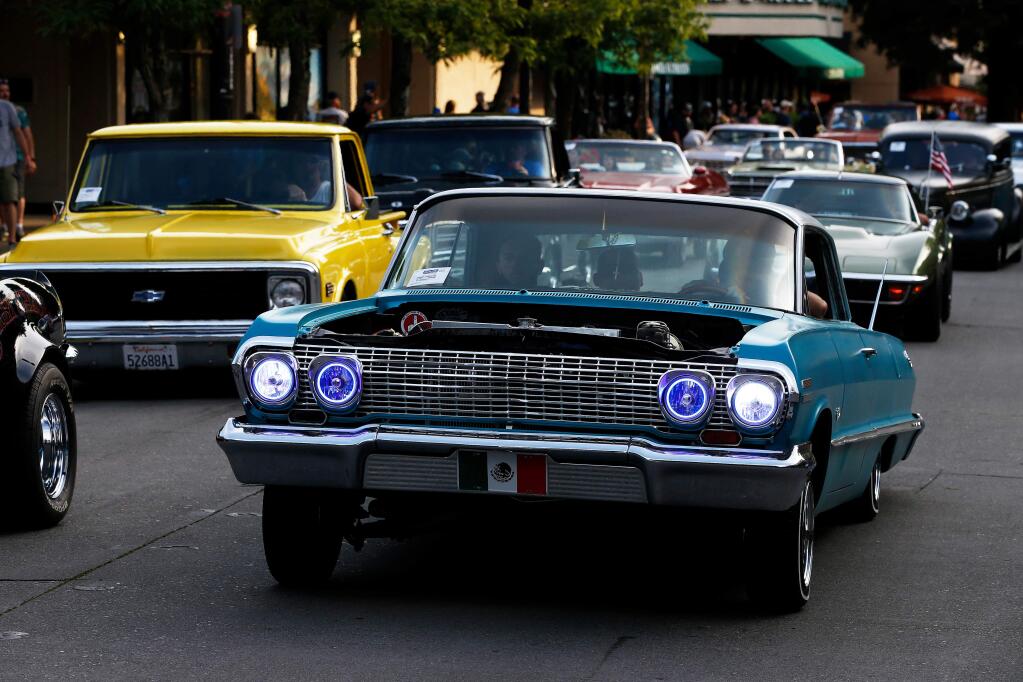 Adam Martinez drives his 1963 Chevrolet Impala along 4th Street during Peggy Sue's Cruise in Santa Rosa, California, on Saturday, June 8, 2019. (Alvin Jornada / The Press Democrat)