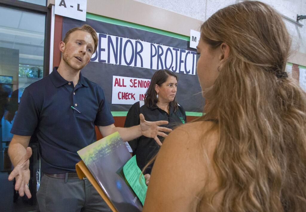 At the Sonoma Valley High School 'rush' last year, 2016, Bryan Kelly, Senior Project Coordinator, talks with Brianna Gorman,16, about what subject she'd chosen for her senior project. (Photo by Robbi Pengelly/Index-Tribune)