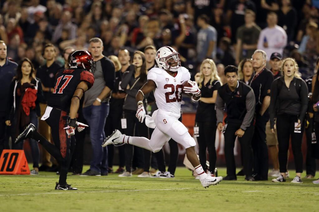 Stanford running back Bryce Love runs on his way to a touchdown during the first half of an NCAA college football game against San Diego State on Saturday, Sept. 16, 2017, in San Diego. (AP Photo/Gregory Bull)