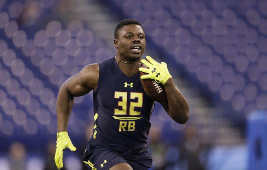 Utah running back Joe Williams runs a drill at the NFL football scouting combine Friday, March 3, 2017, in Indianapolis. (AP Photo/David J. Phillip)