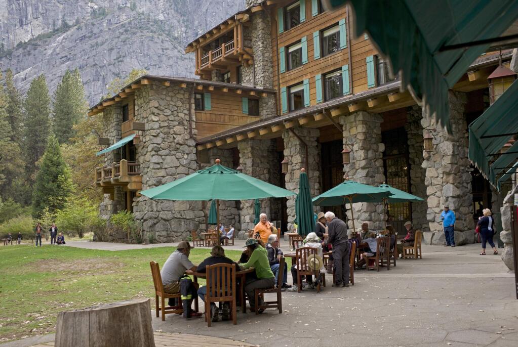 FILE - In this Oct. 24, 2015, file photo, people dine outside the Ahwahnee hotel in Yosemite National Park, Calif. (AP Photo/Ben Margot, File)