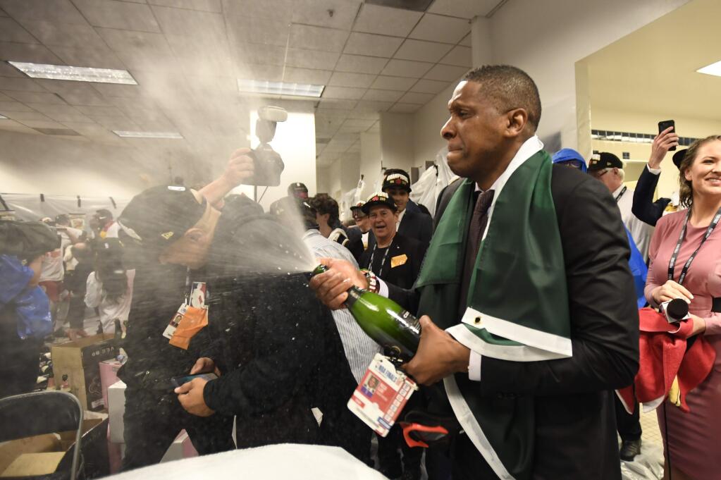 Toronto Raptors President Masai Ujiri celebrates after the team's 114-110 win over the Golden State Warriors in Game 6 of basketball's NBA Finals, Thursday, June 13, 2019, in Oakland, Calif. (Frank Gunn/The Canadian Press via AP)