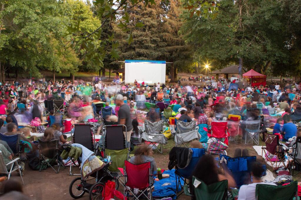 Families enjoy one of the films being shown at the Movies in the Park series at Howarth Park in Santa Rosa in 2015. (JC PHOTOGRAPHY)