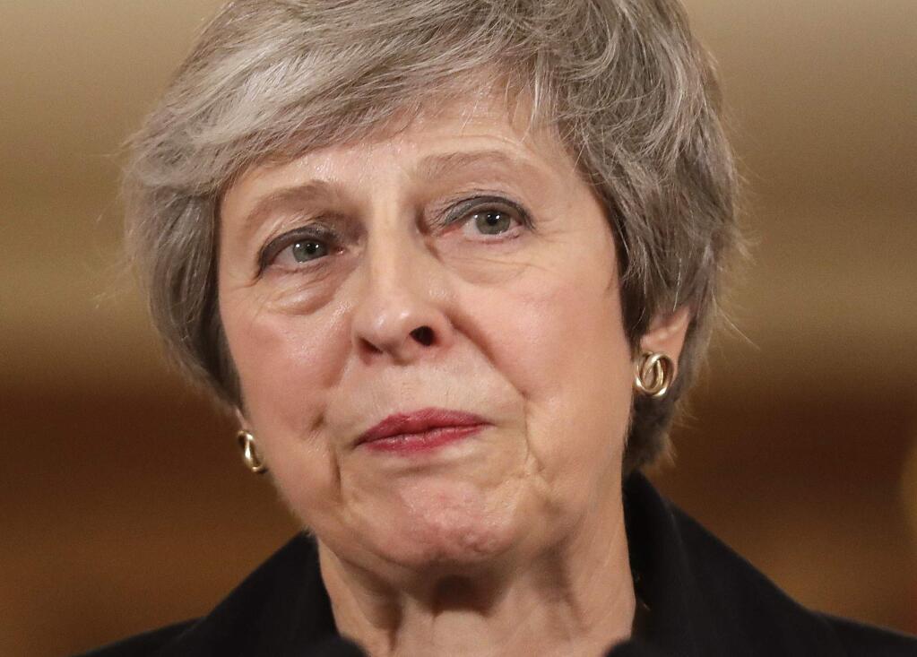 Britain's Prime Minister Theresa May speaks during a press conference inside 10 Downing Street in London, Thursday, Nov. 15, 2018. British Prime Minister Theresa May says if politicians reject her Brexit deal, it will set the country on 'a path of deep and grave uncertainty.' Defiant in the face of mounting criticism, May said Thursday she believed 'with every fiber of my being' that the deal her government struck with the European Union was the right one. (AP Photo/Matt Dunham, Pool)