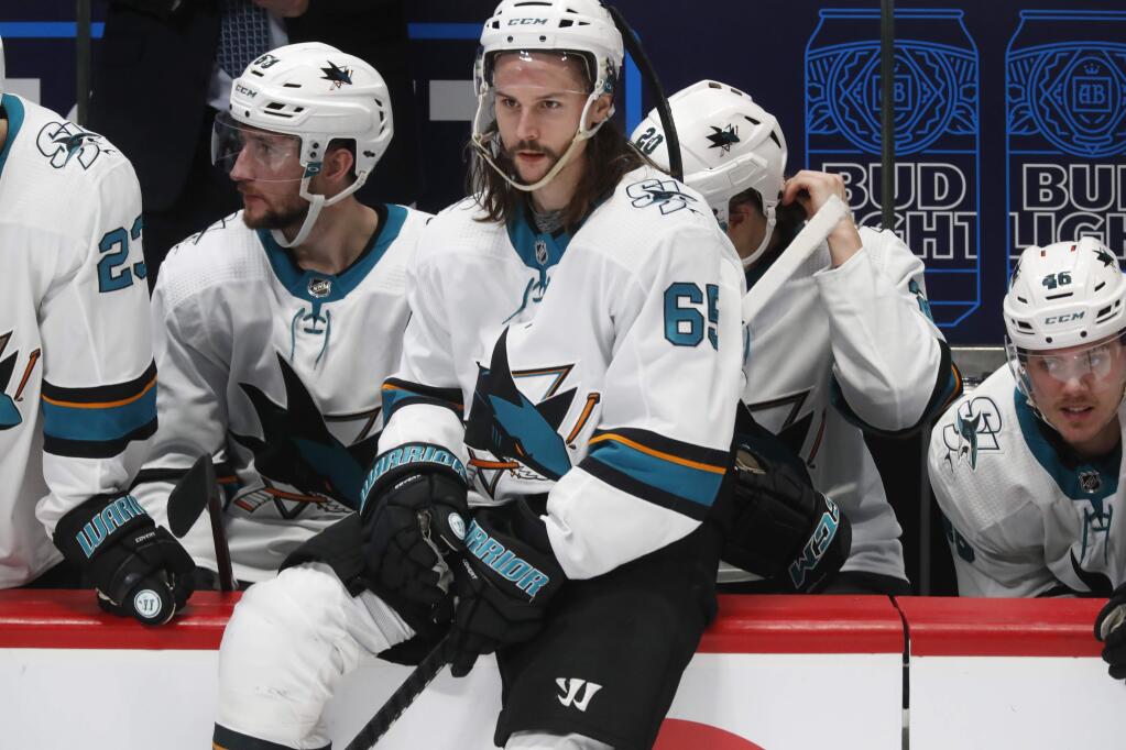 San Jose Sharks defenseman Erik Karlsson sits on the rail of the team box during a stop in play late in the third period against the Colorado Avalanche on Thursday, Jan. 16, 2020, in Denver. Colorado won 4-0. (AP Photo/David Zalubowski)