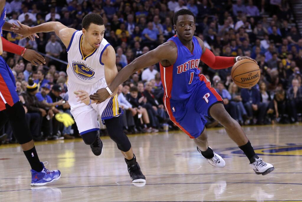 Detroit Pistons' Reggie Jackson (1) dribbles next to Golden State Warriors' Stephen Curry during the first half of an NBA basketball game Wednesday, March 11, 2015, in Oakland, Calif. (AP Photo/Marcio Jose Sanchez)