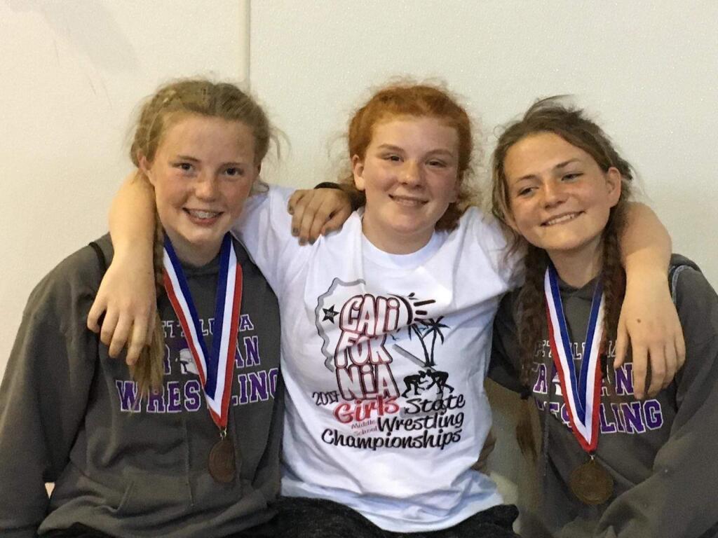 MIKE BUTTS PHOTOThe first athletes ever to compete in the state middle school gtirls wrestling championships were Logan Pomi, Sunshine Sather and Brooklyn Shattuck.