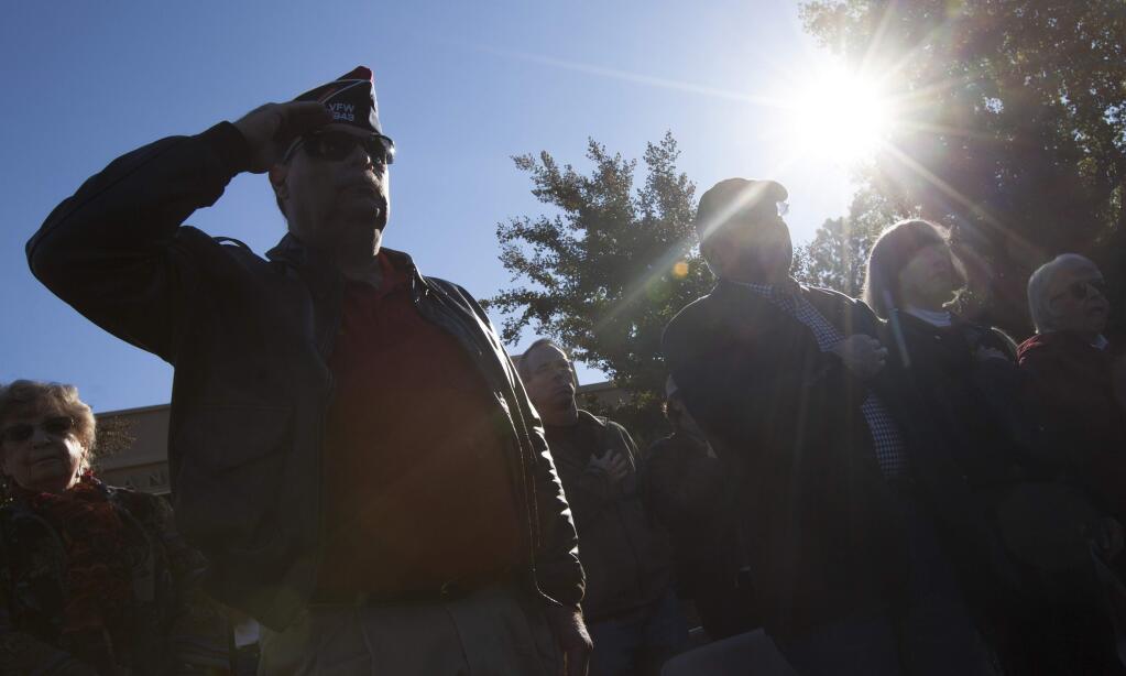 A small crowd gathered on Veterans Day in front of the Sonoma Veterans Memorial Hall in 2016 to witness the ceremonial burning of well-used American flags. When a flag is ready for retirement, the most common method is to respectfully, and with dignity, burn it to ashes. (Photos by Robbi Pengelly/Index-Tribune)