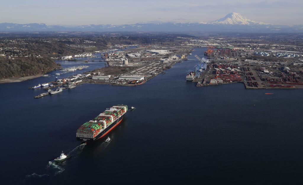 FILE - In this March 5, 2019, file photo, a cargo ship arrives at the Port of Tacoma, in Tacoma, Wash. Over the past month, President Donald Trump has rolled the dice on the economy. He has more than doubled tariffs on $200 billion in Chinese imports. He's preparing to target another $300 billion, extending his import taxes to everything China ships to the United States.(AP Photo/Ted S. Warren, File)