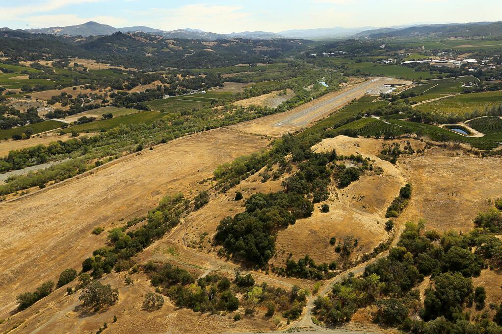 The formerly proposed 254-acre Alexander Valley Resort, seen in the lower part of the image in brown grass, is now off the books and the property is being offered for sale again. (JOHN BURGESS / The Press Democrat)