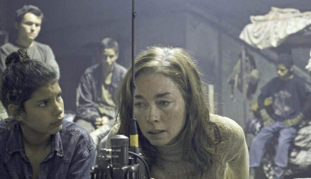 Julianne Nicholson plays Sara, an American who is being held captive by a group of child soldiers, actually young teenagers, are attempting to live as wilderness warriors in a remote area of Latin America in 'Monos.' (NEON)