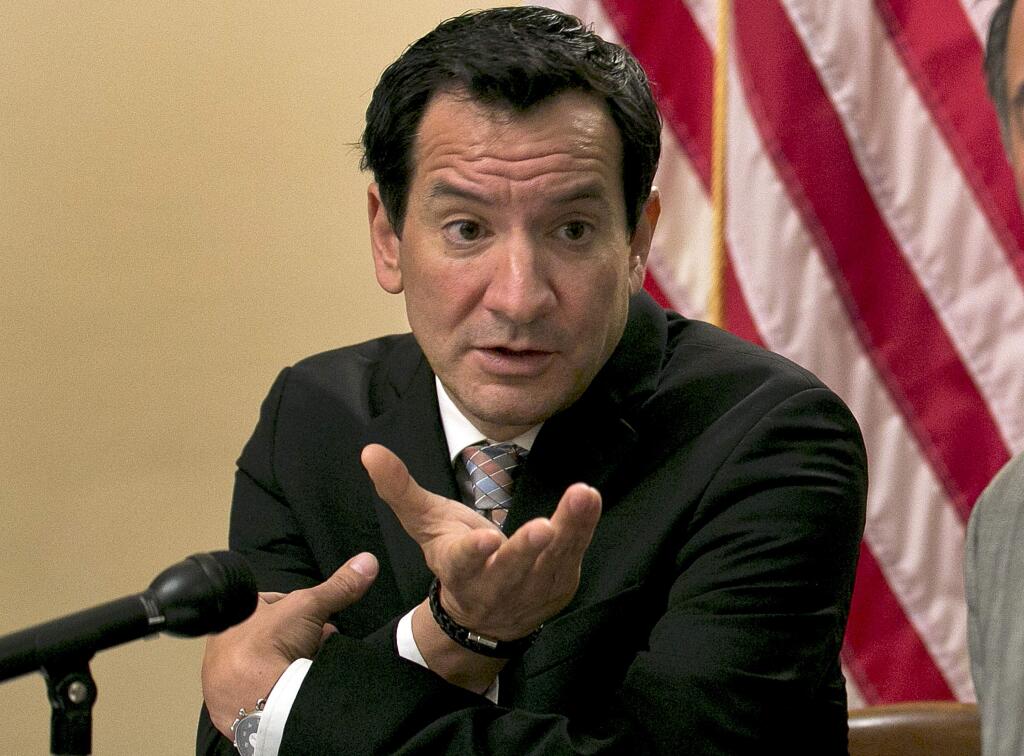 FILE - In this June 13, 2017, file photo Assembly Speaker Anthony Rendon, D-Paramount, left, responds to a question concerning the state budget agreement reached between Gov. Jerry Brown and Democratic lawmakers in Sacramento. The California Assembly plans to host public hearings to discuss sexual harassment at the Capitol. The hearings announced by Speaker Anthony Rendon on Tuesday, Oct. 24, 2017, will begin in November and are meant to 'air out institutional advancements that need to be made.' His announcement follows a letter released by nearly 150 women who work in and around the Capitol last week highlighting a pervasive culture of harassment. (AP Photo/Rich Pedroncelli, File)