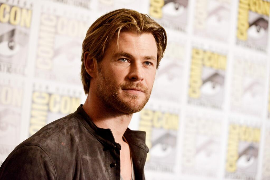 FILE - In this July 26, 2014 file photo, Chris Hemsworth attends the Marvel press line at Comic-Con International in San Diego. People magazine has named Chris Hemsworth the ìSexiest Man Aliveî of 2014, cheering the Australian actorís rise as hammer-wielding, bone fide hunk in the ìThorî films. (Photo by Richard Shotwell/Invision/AP, File)