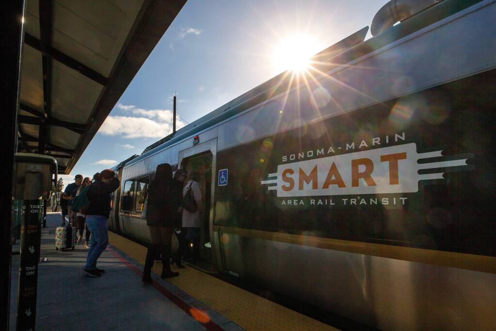 Passengers board a southbound SMART train at the Railroad Square station in Santa Rosa, California, on Thursday, Feb. 13, 2020. (Alvin A.H. Jornada / The Press Democrat)