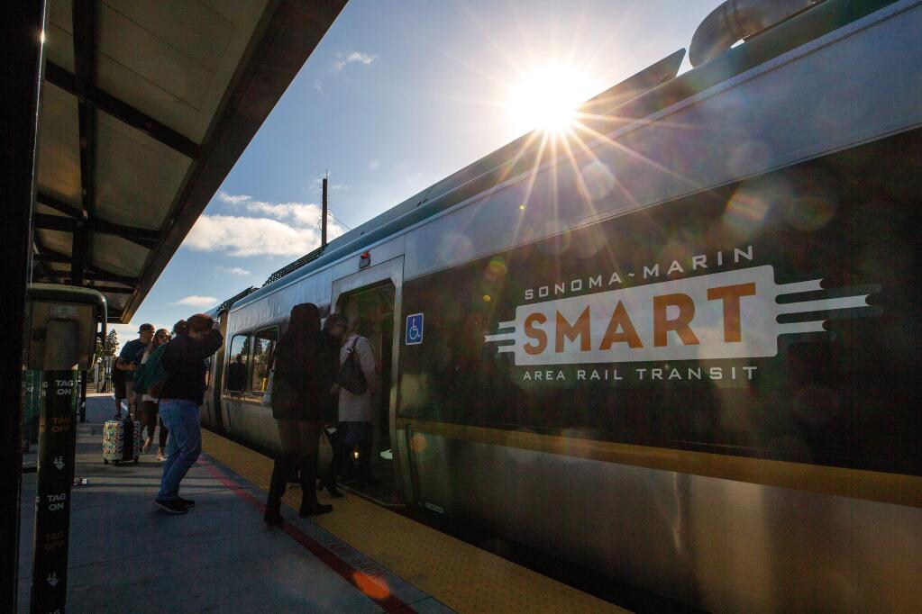 Passengers board a southbound SMART train at the Railroad Square station in Santa Rosa, California, on Thursday, Feb. 13, 2020. (Alvin A.H. Jornada / The Press Democrat)