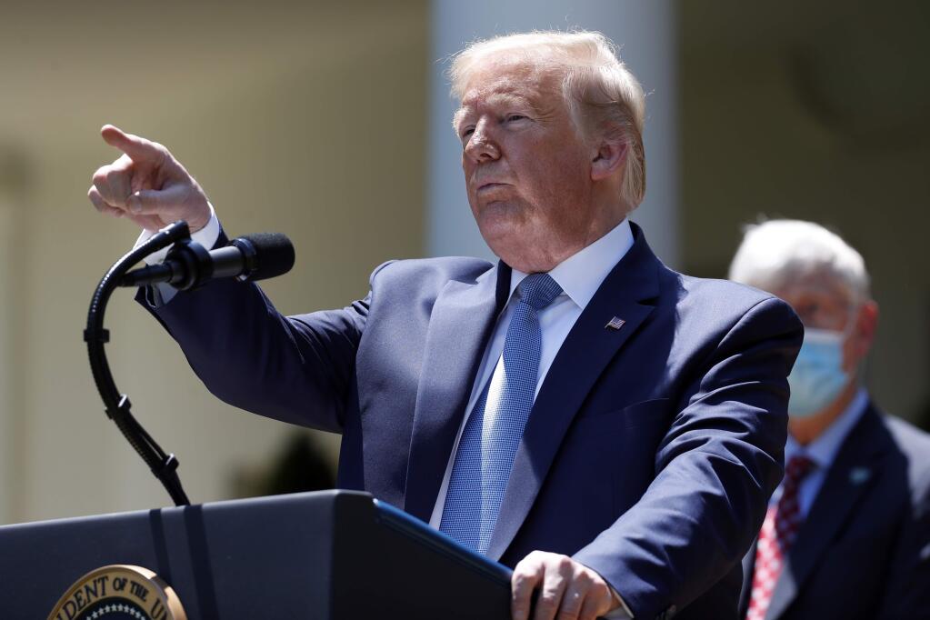 President Donald Trump answers questions during a press briefing about the coronavirus in the Rose Garden of the White House, Friday, May 15, 2020, in Washington. (AP Photo/Alex Brandon)