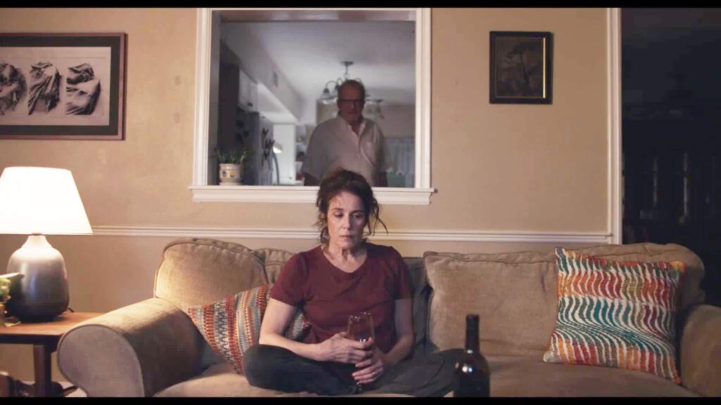 Debra Winger and Tracy Letts, in back, play a couple trapped in a dull marriage and who are both having affairs in 'The Lovers.' (A24 Films)