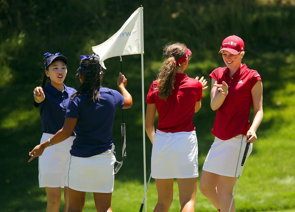 From right, golfers for the east team, Emilia Migliaccio and Rachel Heck, beat Yujeong Son and Lucy Li from the west team at the USGA Wyndham Cup junior golf championship at Mayacama. (John Burgess / The Press Democrat)