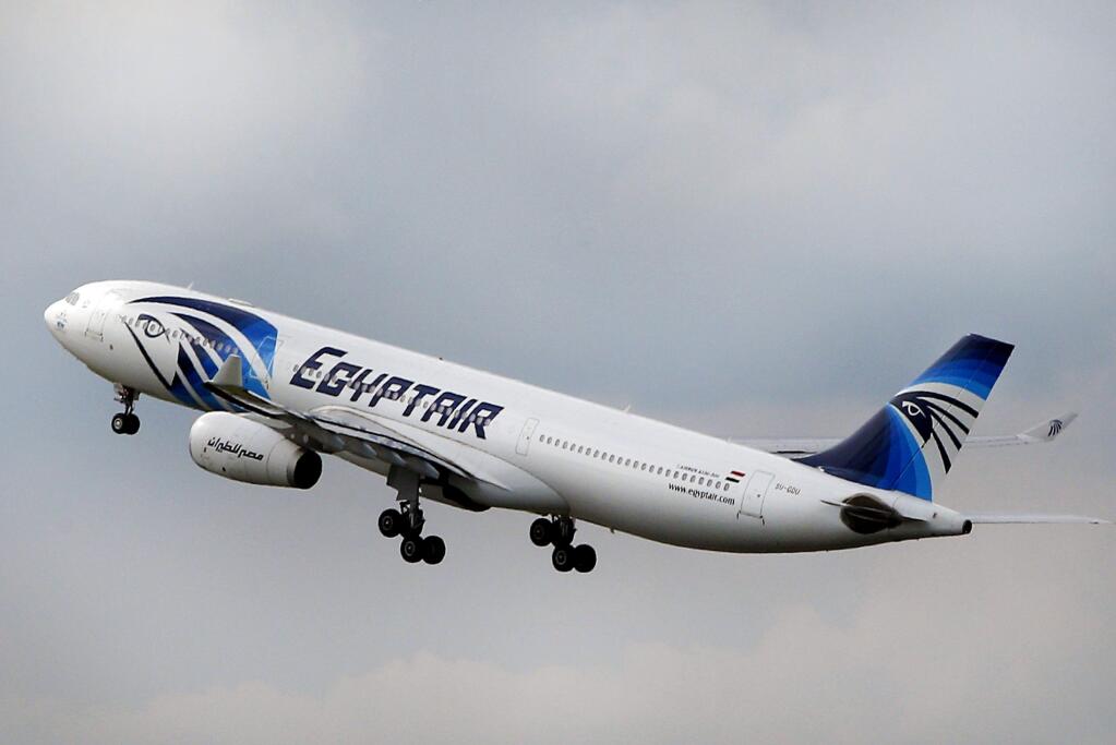 FILE - In this Thursday, May 19, 2016 file photo, An EgyptAir Airbus A330-300 takes off for Cairo from Charles de Gaulle Airport outside of Paris. Egyptian investigators say the black boxes from a passenger plane that crashed last month have arrived in Paris, where technicians will attempt to repair them. Both were extensively damaged when EgyptAir Flight 804 from Paris to Cairo crashed into the Mediterranean on May 19, killing all 66 people on board. (AP Photo/Christophe Ena, File)