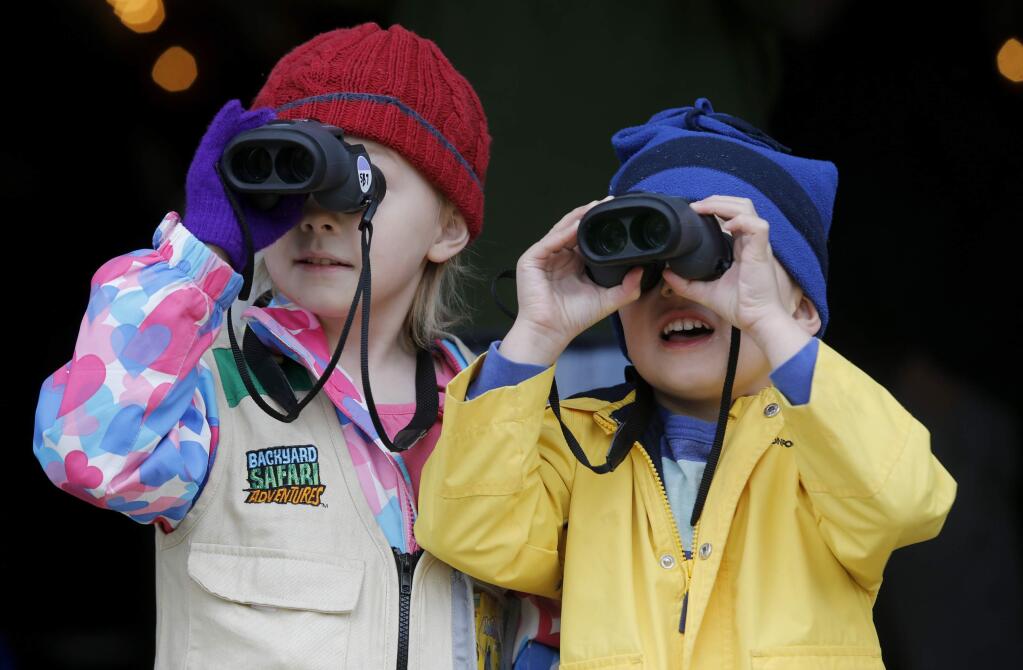Madeleine Edwards, then 6, and her brother Sullivan, 4, practiced their bird-watching skills during a binocular bootcamp as part of the 8th annual Christmas Bird Count for Kids at the Sonoma Barracks on Sunday, January 3, 2016. (BETH SCHLANKER/The Press Democrat)