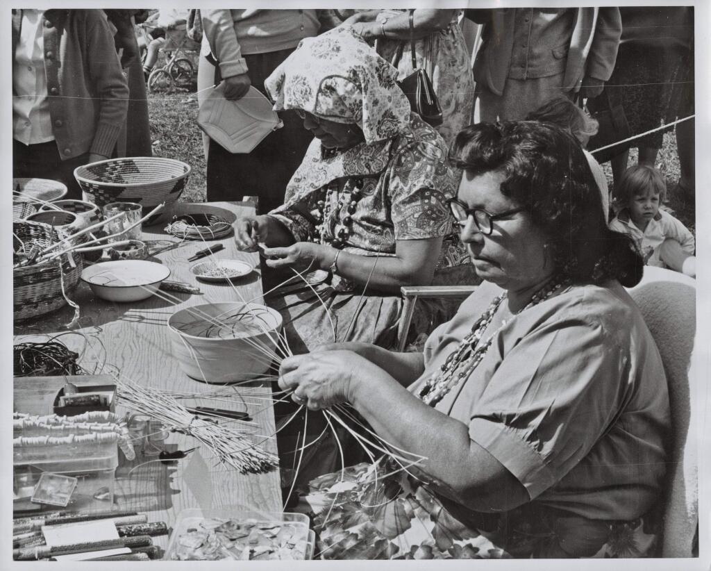 Essie Parrish (1902-1979), pictured here wearing glasses, was a Pomo basket weaver and spiritual leader who preserved the language and culture of her people. In the 1920s she established a bilingual language and cultural class at Stewarts Point Rancheria. She also contributed to documentaries about Kashia Pomo culture and collaborated with UC Berkeley linguist Robert Oswalt on a dictionary of the Kashia Pomo language. (Sonoma County Library)