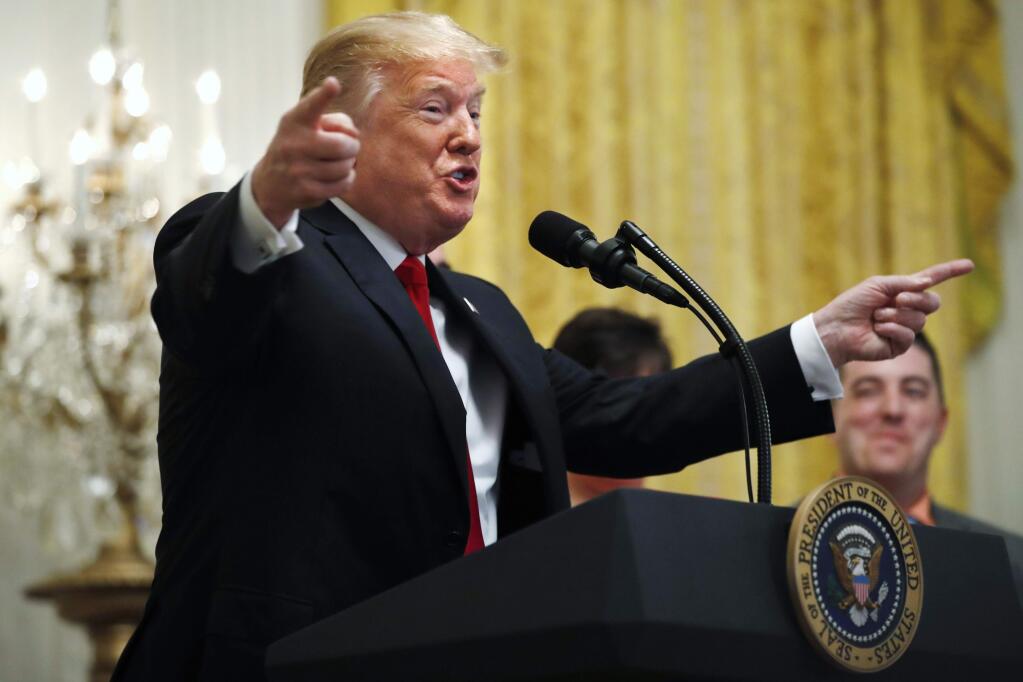 President Donald Trump gestures as he speaks about taxes, Friday, June 29, 2018, during an event in the East Room of the White House in Washington. (AP Photo/Jacquelyn Martin)