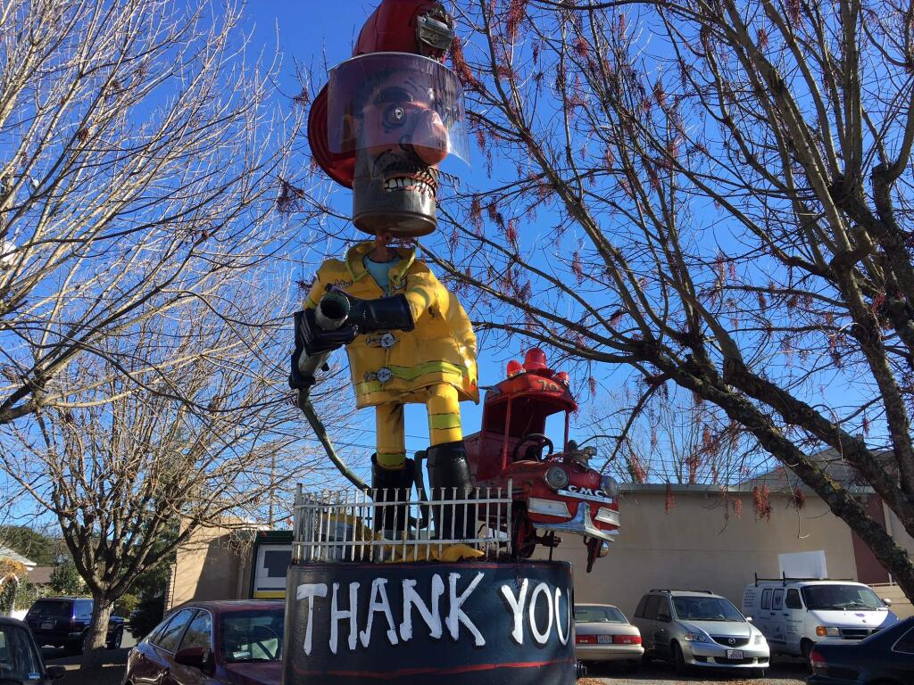 Junk artist Patrick Amiot's tribute to firefighters on Cleveland Avenue at 10th Street in Santa Rosa. (Chris Smith / Press Democrat)