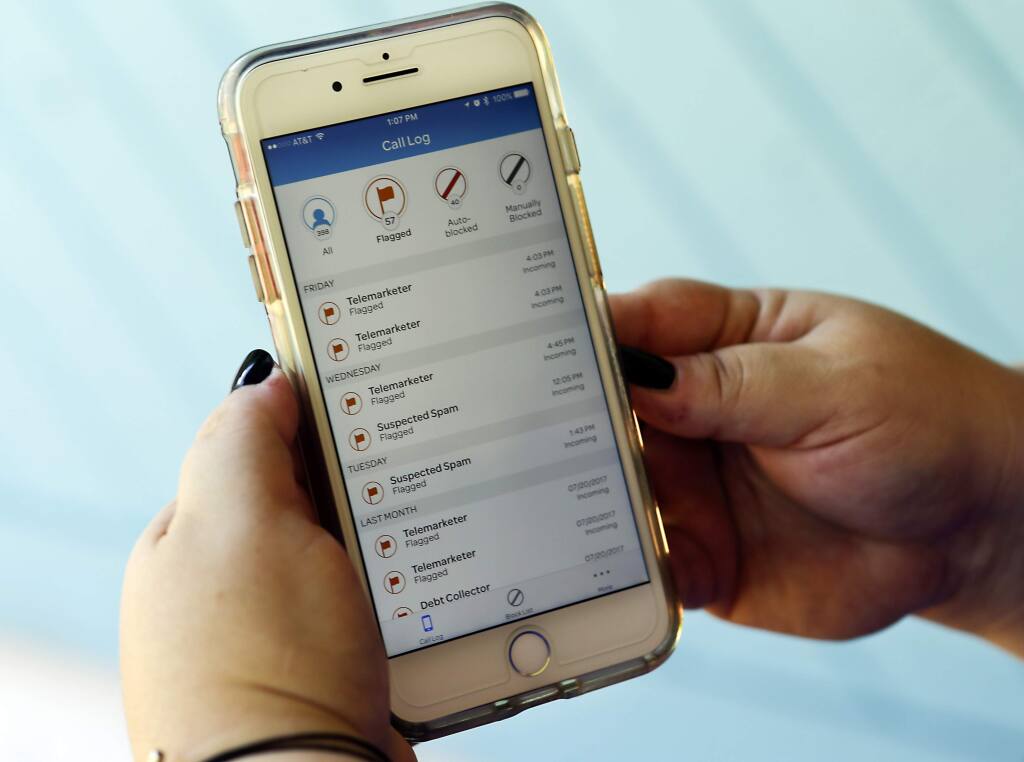 FILE - This Aug. 1, 2017, file photo, shows a call log displayed via an AT&T app on a cellphone in Orlando, Fla. (AP Photo/John Raoux, File)