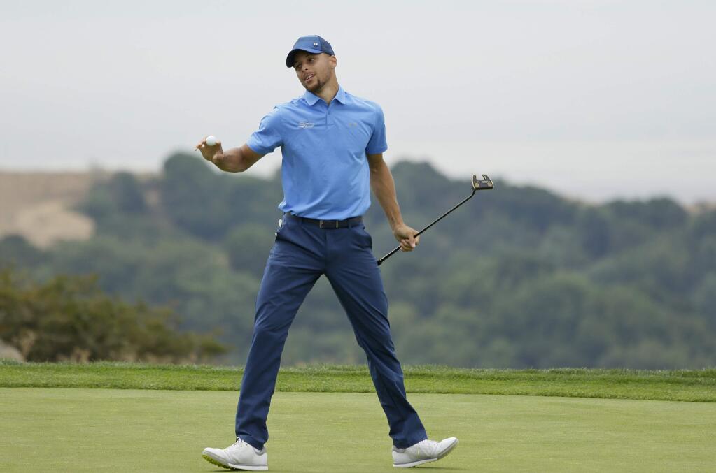 Golden State Warriors NBA basketball player Stephen Curry reacts after saving par on the 18th green during the Web.com Tour's Ellie Mae Classic golf tournament Thursday, Aug. 3, 2017, in Hayward, Calif. (AP Photo/Eric Risberg)