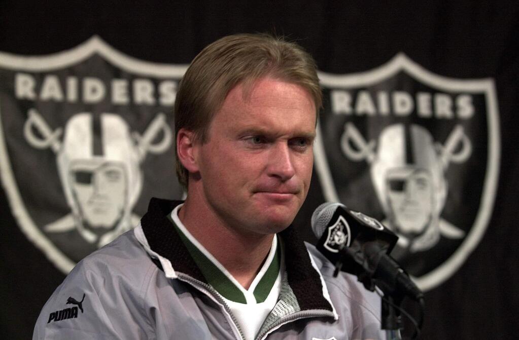 In this Jan. 14, 2001, file photo, then-Oakland Raiders' coach Jon Gruden is shown during a press conference at Raiders headquarters in Alameda. Gruden says he had a good talk with Oakland Raiders owner Mark Davis about returning to the organization for a second stint as coach and believes there is a 'good chance' it will happen. (AP Photo/Ben Margot, File)