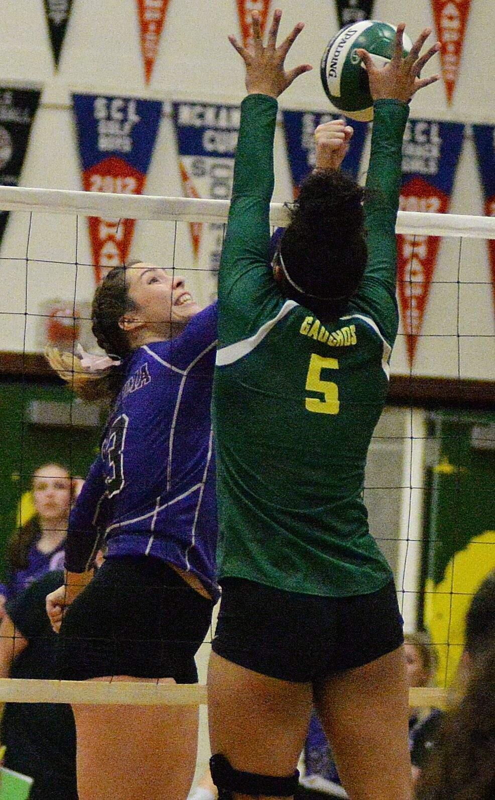 Casa Grande's Simone Wright blocks a punch attempt by Petaluma's Emma Weiand. (SUMNER FOWLER / FOR THE ARGUS-COURIER)